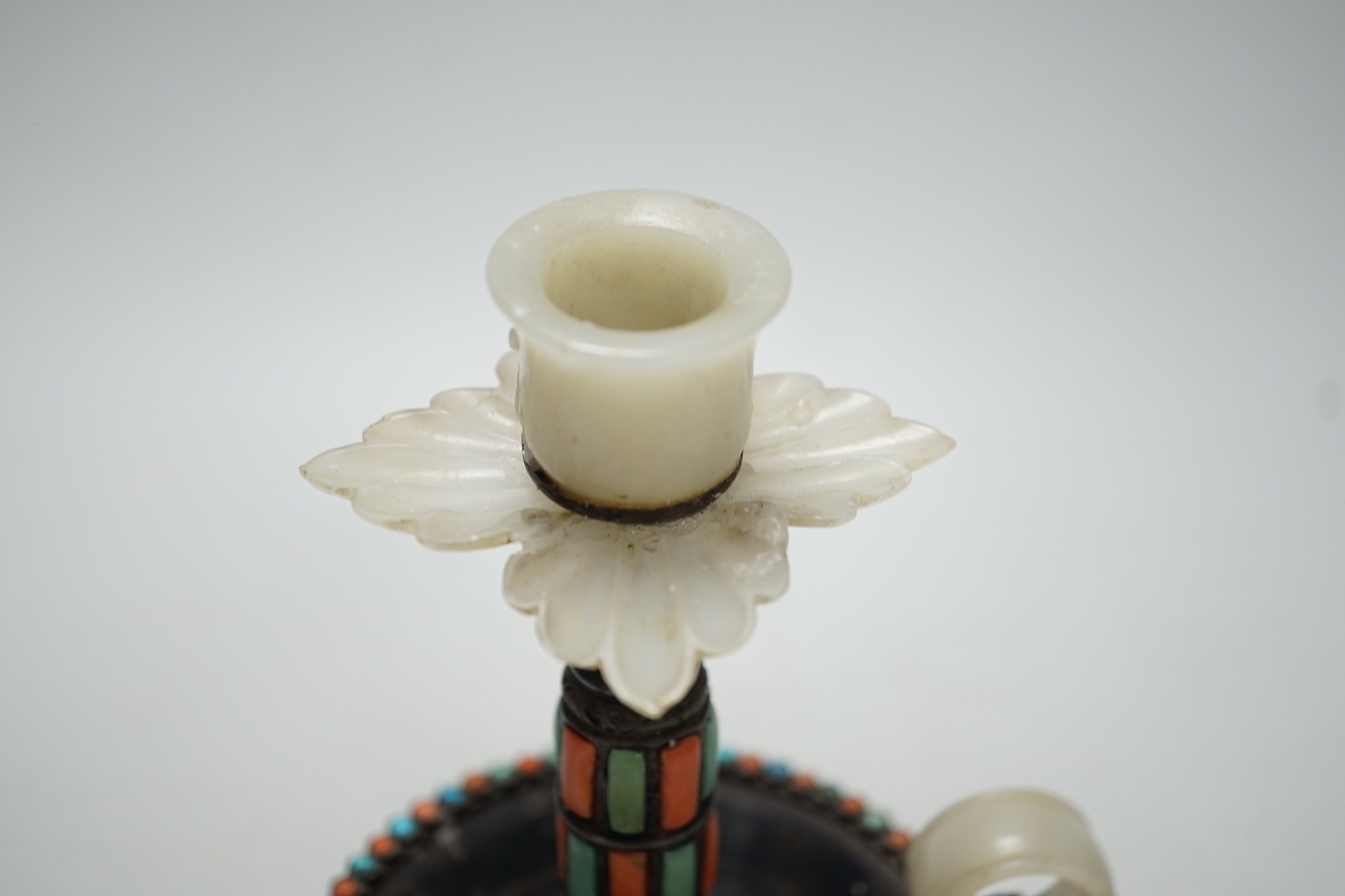 A Chinese white metal jade, coral and turquoise mounted chamberstick, late 19th century, the jade possibly earlier 15cm